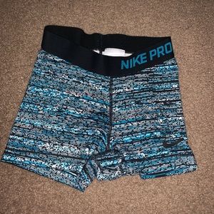 Women’s black and blue nike pros